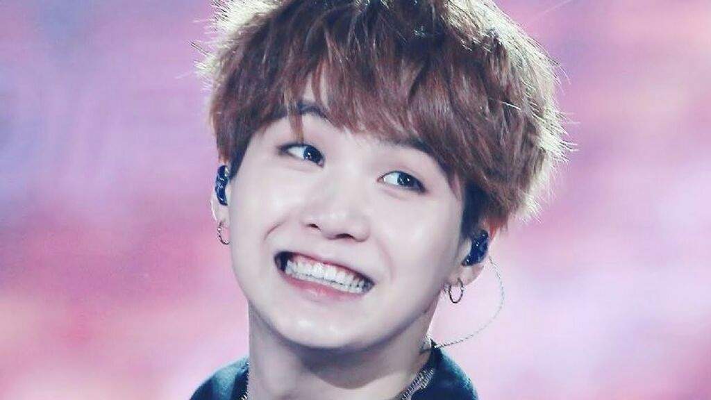 There are so many pictures of Yoongi's gummy smile but this one is nic...