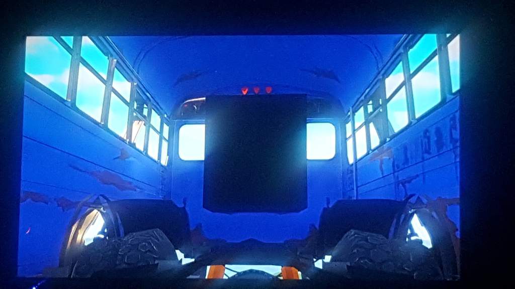 this image is overlooking the back of the battle bus you can see the door in the back what really fascinated me was that i could see the tires coming in - the fortnite battle bus