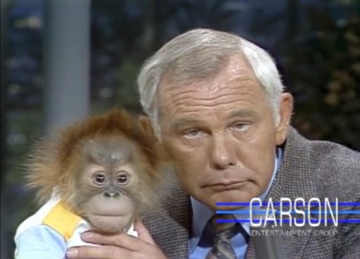 Johnny Carson holding a baby orangutan, 1977 | Vintage Vibes Amino