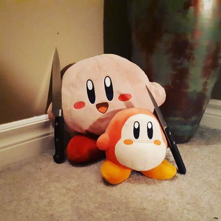 plush kirby with a knife